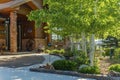 Home entrance brick redwood siding aspen landscaping Royalty Free Stock Photo