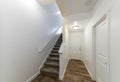 Home entrance interior with staircase and hallway with wooden flooring