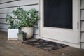 Home entrance with potted plants and succulents