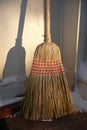 Home: entry with straw broom in winter Royalty Free Stock Photo