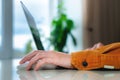 home environment, woman& x27;s hand rests on laptop mouse, work from home Royalty Free Stock Photo