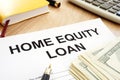 Home equity loan form and cash on a table. Royalty Free Stock Photo