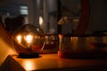 Home evening interior close up. Luminous light bulb inside glass ball