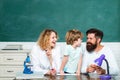 Home Family math schooling - Parents teaching kids private lessons in math. Happy young couple who are standing with