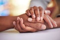 Home, family and people holding hands on table for bonding, love and happy relationship in house. Affection, wellness Royalty Free Stock Photo