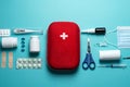 Home first aid kit on a blue background. The elements of the first aid kit are laid out on the table Royalty Free Stock Photo