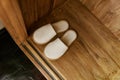 Home floor footwear household object soft shoe pair comfortable white slipper