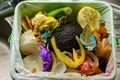 Home food waste container full leftovers vegetables in a plastic bag close up shot in the kitchen Royalty Free Stock Photo