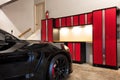 Home garage interior highly organized and clean with parked car Royalty Free Stock Photo