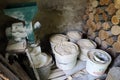 Home grain mill, ground animal feed in buckets, stacked firewood in shed Royalty Free Stock Photo