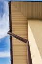 Home Guttering, Gutters, Plastic Guttering System, Guttering & Drainage Pipe Exterior against blue sky. Royalty Free Stock Photo