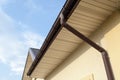 Home Guttering, Gutters, Plastic Guttering System, Guttering & Drainage Pipe Exterior against blue sky. Royalty Free Stock Photo