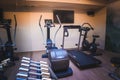 Home Gym with Dumbbells, Cardio Machines, Treadmill and Entertainment Setup Royalty Free Stock Photo