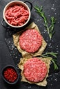 Home HandMade Raw Minced Beef steak burgers. Farm organic meat. Black background. Top view Royalty Free Stock Photo