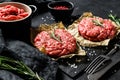 Home HandMade Raw Minced Beef steak burgers. Farm organic meat. Black background. Top view Royalty Free Stock Photo