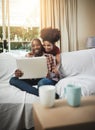 Home, happiness and black couple with laptop, love and connection with internet, smile and lens flare. Apartment