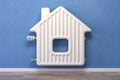 Home heating radiator in the form of house