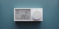 Digital thermostat on blue wall. Home heating temperature control device close up. 3d render Royalty Free Stock Photo