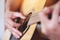 Home hobbies concept, Man hands playing acoustic guitar, close up guitar player Musical instrument for recreation or hobby passion Royalty Free Stock Photo