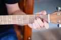 Home hobbies concept, Man hands playing acoustic guitar, close up guitar player Musical instrument for recreation or hobby passion Royalty Free Stock Photo