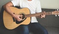 Home hobbies concept, Man hands playing acoustic guitar, close up guitar player Musical instrument for recreation or hobby passion Royalty Free Stock Photo