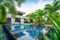 Home or house building Exterior and interior design showing tropical pool villa with green garden Royalty Free Stock Photo