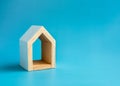 Home, house, family, real estate, property concepts. Minimal miniature wooden white small house with empty area inside for text. Royalty Free Stock Photo