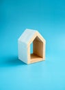 Home, house, family, real estate, property concepts. Minimal miniature wooden white small house with empty area inside. Royalty Free Stock Photo