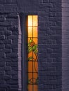 home house leaded lights window stained glass flowers roses glow orange lighting panels Royalty Free Stock Photo