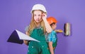Home improvement activity. Kids girls planning renovation. Repaint walls. Move in new apartment. Children sisters run Royalty Free Stock Photo
