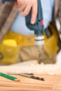 Home improvement - handyman drilling wood Royalty Free Stock Photo