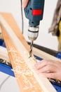 Home improvement - handyman drilling wood Royalty Free Stock Photo