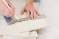 Home improvement - handywoman measuring tile Royalty Free Stock Photo