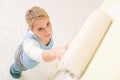 Home improvement - handywoman painting wall Royalty Free Stock Photo