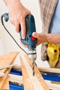 Home improvement - man drilling wood Royalty Free Stock Photo