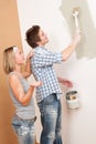 Home improvement Man painting wall with paintbrush Royalty Free Stock Photo