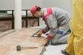 Home improvement, renovation - construction worker tiler is tili