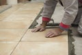 Home improvement, renovation - construction worker tiler is tiling