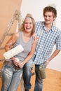 Home improvement: Young couple painting wall Royalty Free Stock Photo