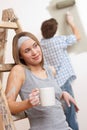Home improvement: Young couple painting wall Royalty Free Stock Photo