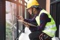 Home inspection consultancy. Inspector checking material of balcony and looking for fracture