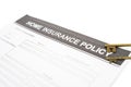 Home insurance policy document paper near old keys