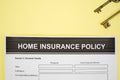 Home insurance policy form with two home key Royalty Free Stock Photo