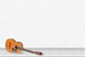 Home interior - Classic guitar in front of white wall Royalty Free Stock Photo