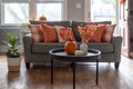 Home interior decorated for fall with orange accent pillows on the couch Royalty Free Stock Photo