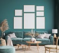 Home interior design with green sofa, wooden table and trendy decoration in green living room, gallery wall Royalty Free Stock Photo