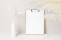 Home interior floral decor, pampas grass on table, Front view, clipboard, Greeting card Mockup. Beautiful white pampas grass in