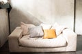 Home interior with a gray rectangular sofa with pillows in light beige shades Royalty Free Stock Photo