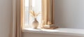 Home interior. Living room interior with books, ceramic vase with dried flowers and window.