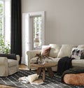 Home interior in neutral colors, living room with sofa, armchair and dry flower on table